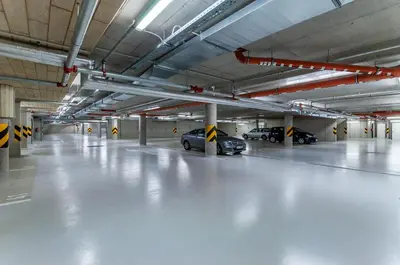 a large parking garage with cars parked in it at Fortuna Garden V in Prague