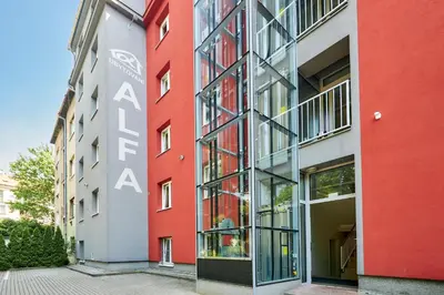 a facade of a building with red at Apartmány Ubytování Alfa in Prague