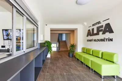 a waiting room with green benches in a building at Apartmány Ubytování Alfa in Prague