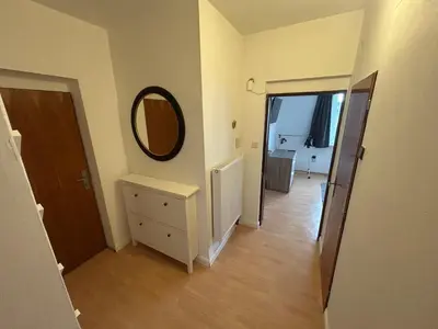 a hallway with a mirror on the wall and a door at Prague apartment - Close to airport and metro in Prague
