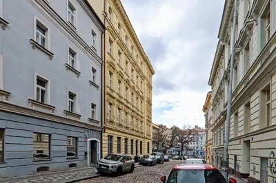 a city street with cars parked next to buildings at Kora Premiere Collection in Prague