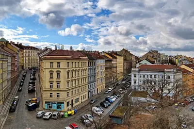 a city with cars parked in a parking lot at Kora Premiere Collection in Prague