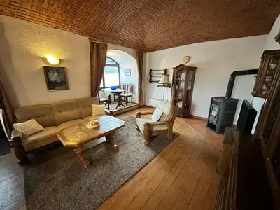 an overhead view of a living room with a couch and a table at Apartmány v Buši in Buš