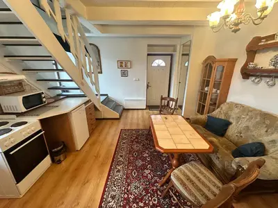 a living room with a couch and a table at Apartmány v Buši in Buš