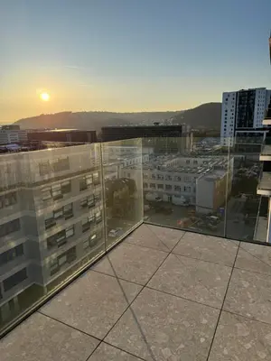 a view of a city from the roof of a building at Luxury 3-room apartment with swimming pool - Modřany in Prague
