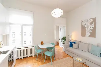 a living room with a couch and a table at Elegant,Bright,Best location in Prague