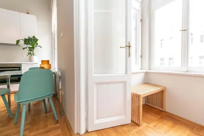 a room with a table and a chair and a window at Elegant,Bright,Best location in Prague