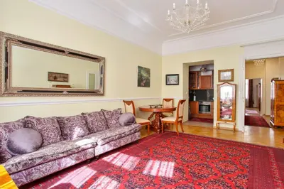 a living room with a couch and a table at Prague Imperial Heritage in Prague