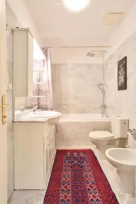 a bathroom with a sink and a toilet and a tub at Prague Imperial Heritage in Prague