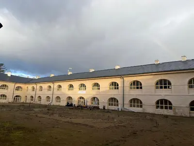 a large building with a lot of windows at Artillery Barracks Accommodation in Terezín