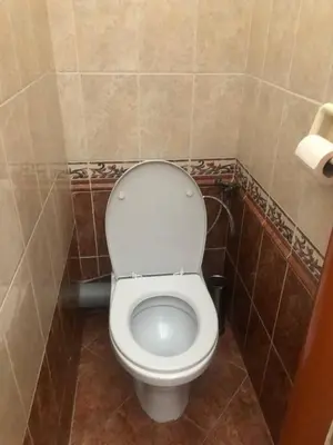 a bathroom with a white toilet in a room at Central cozy rooms Soukenická S34 in Prague