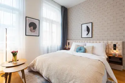 a bedroom with a large bed and a table at Harry Potters Magical Diagon Alley Stay in Prague in Prague