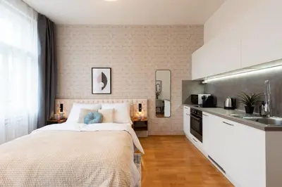 a bedroom with a large bed and a sink at Harry Potters Magical Diagon Alley Stay in Prague in Prague