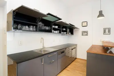a kitchen with a sink and a counter at Bright 1 BR, close to Malá Strana & Dancing House in Prague
