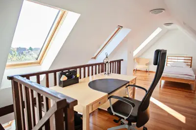 a home office with a desk and a chair at Guest House Villa Monet in Prague