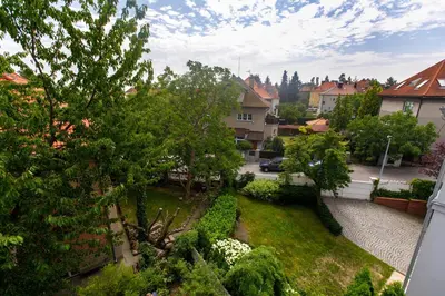 a view of a yard with trees and bushes at Guest House Villa Monet in Prague