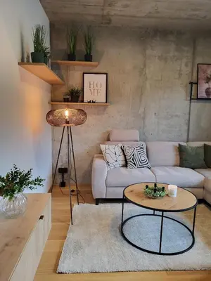 a living room with a couch and a table at PRAHA 5, apartmán PECHLÁTOVA - BAZÉN, PARKOVÁNÍ V DOMĚ in Golčŭv Jeníkov