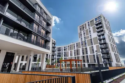 two tall apartment buildings with a gazebo in the middle at Stylish Studio with Private Hot Tub & Terrace in Prague