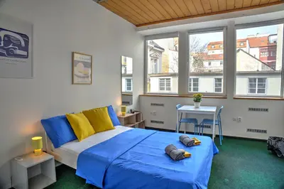 a bedroom with a bed and a window at Station Stay Rooms near Main Train Station in Prague