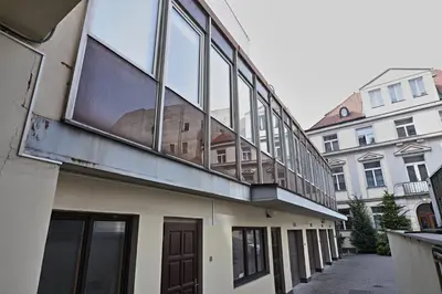 a room with two beds and a window at Station Stay Rooms near Main Train Station in Prague