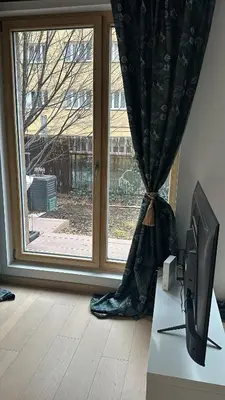 a computer monitor sitting on a desk in front of a window at Apartments Palmovka in Prague