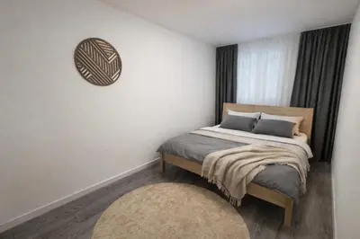 a small bedroom with a bed and a window at Luxury 2BR Apartment Best Location Prague in Prague