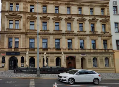 a white car parked in front of a building at Luxury 2BR Apartment Best Location Prague in Prague