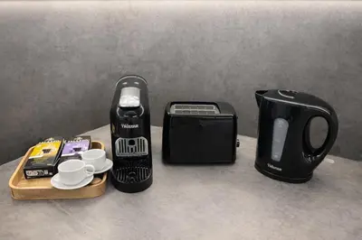 a coffee maker and a toaster on a counter at Luxury 2BR Apartment Best Location Prague in Prague