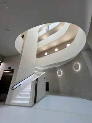 a staircase in a building with a large ceiling at The Urban Nest - Grand Residence in Prague