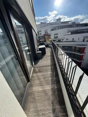 a balcony of a building with a wooden walkway at The Urban Nest - Grand Residence in Prague