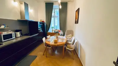 a kitchen and dining room with a table and chairs at LOvely room in the Centre in Prague