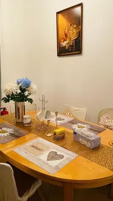 a wooden table with a cross on top of it at LOvely room in the Centre in Prague