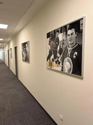 a hallway with a poster of a hockey player on a wall at Sport hotel Sletiště in Kladno