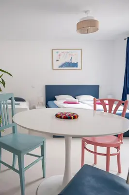 a white table and chairs in a room at Tichý byt blízko Pražského hradu in Prague