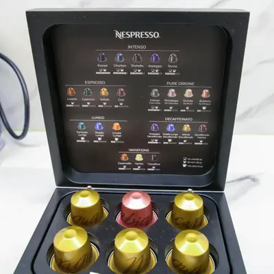 a set of four cupcakes in a box at White & Gray Apartments in Prague