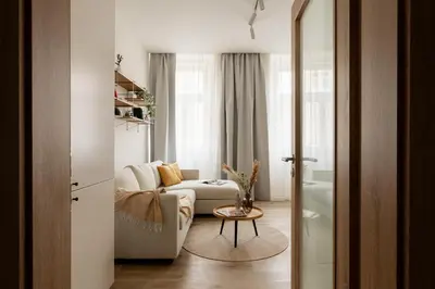 a living room with a couch and a table at U Zvonu Deluxe Apartments with Self Check-in in Prague