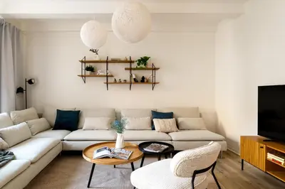 a living room with a couch and a table at U Zvonu Deluxe Apartments with Self Check-in in Prague