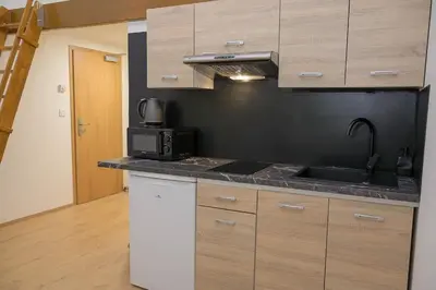 a kitchen with a sink and a microwave at Modern New Town Studio Heart of the City in Prague