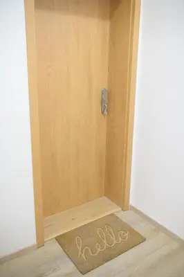 a door with a welcome mat in front of it at Modern New Town Studio Heart of the City in Prague