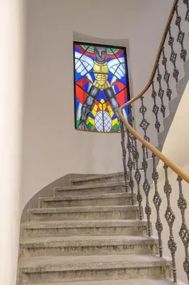 a staircase with a stained glass window at Modern New Town Studio Heart of the City in Prague