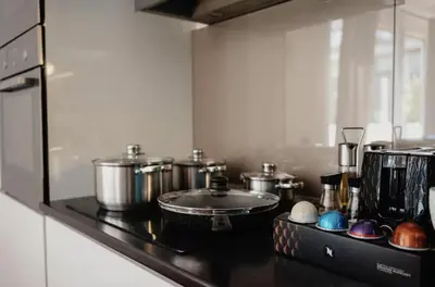 a kitchen with pots and pans on a stove at COZY&DELUX Family apartment 3 min from Metro in Prague