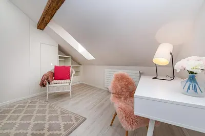 a living room with a desk and a chair at Picturesque Apt in Lesser Town with lovely Terrace in Prague