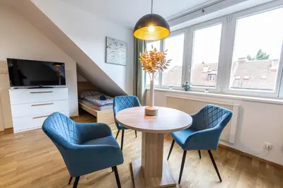 an empty balcony with a bench and a window at Spoon Apartment Prague 2 in Prague
