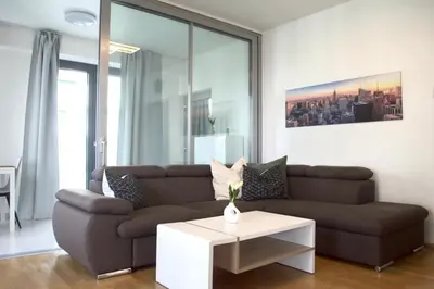 a living room with a couch and a coffee table at Panorama Apartment with Parking in Prague