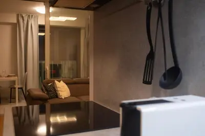 a living room with a couch and a table at Panorama Apartment with Parking in Prague
