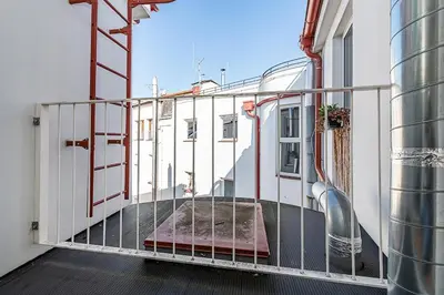 a balcony of a building with a ramp on it at Rooftop APT with beautiful view and free parking in Prague
