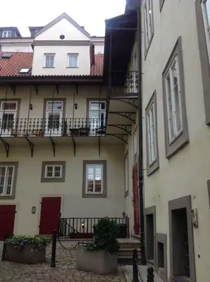 an apartment building with a staircase in front of it at Cozy apt in the heart of Old town in Prague