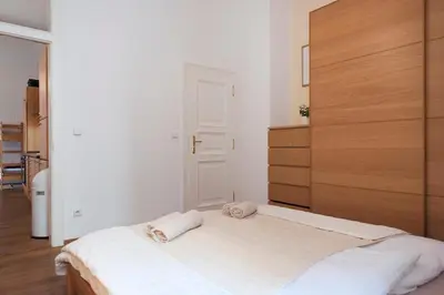 a bedroom with a bed with two towels on it at Cozy apt in the heart of Old town in Prague