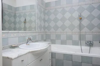a bathroom with a sink and a bath tub at Cozy apt in the heart of Old town in Prague