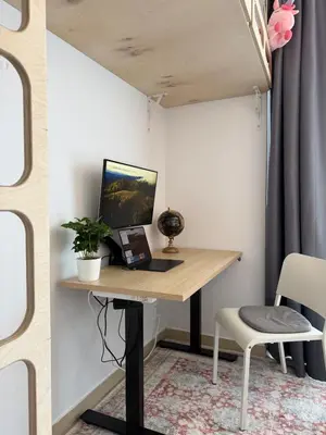 a room with a desk with a laptop and a chair at Easy City Access Bright 1BR with Underground Parking in Prague